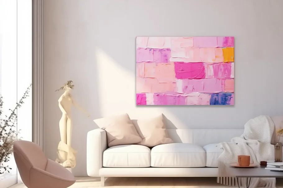 Lienzos decorativos y personalizadoss en Miraflores de la Sierra Pared decorada con un cuadro abstracto de tonos rosas y un sofá blanco en un ambiente moderno.